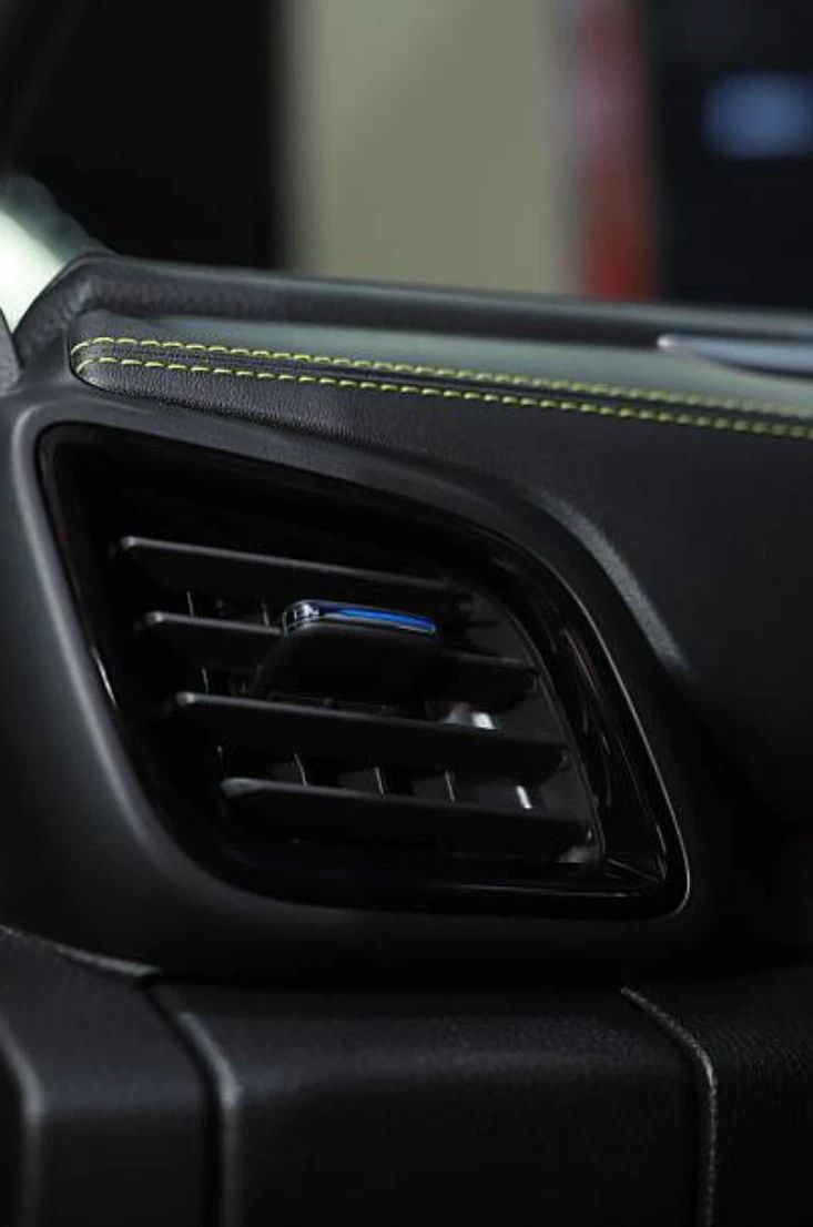 Close-up of a car dashboard air-conditioning vent